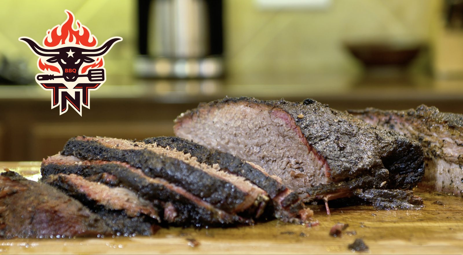 Sliced smoked brisket on a cutting board
